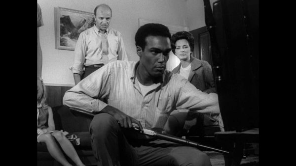 Duane Jones (Ben) prepares for the zombie apocalypse, while Karl Hardman (Harry) runs interference in Night of the Living Dead (1968). Marilyn Eastman (Helen) watches on.