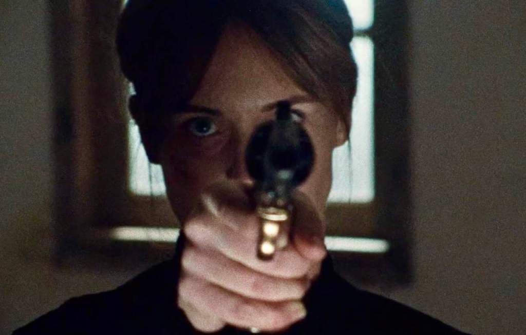 Molly Pray holding a gun