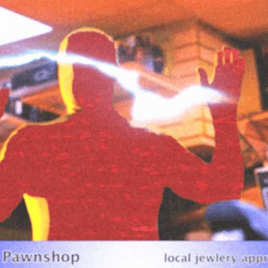 A man in a red shirt with hands raised inside a pawnshop.