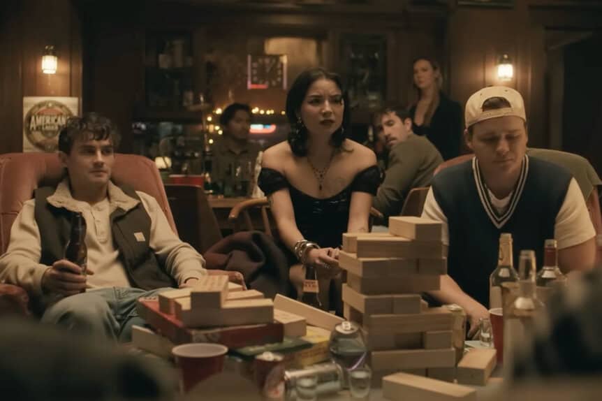 Haunted game night with friends, intense expressions, and spooky atmosphere at a bar.
