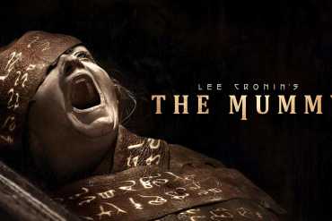 Scary mummy with hieroglyphs on bandages from Lee Cronin's The Mummy review.