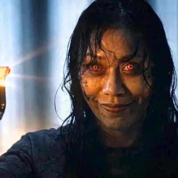 Evil Dead-inspired horror scene with a possessed woman holding a lit lighter.