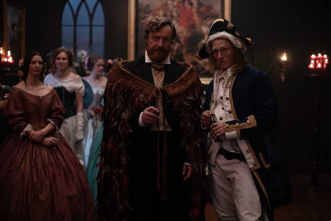 Historical scene with men in 18th-century costumes at a formal event.