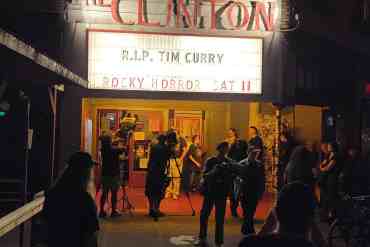 The Clinton theater marquee honoring Tim Curry with a Rocky Horror Picture Show tribute.