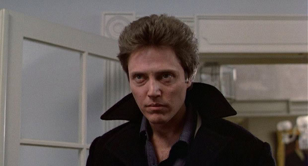 Close-up of a man with intense expression in a sci-fi setting.