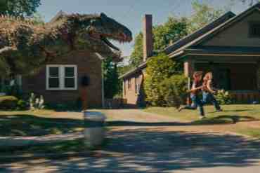 A giant dinosaur chasing two children on a suburban street.