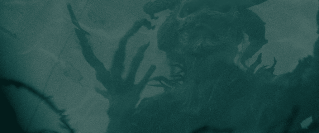 Eerie creature with multiple tentacle-like appendages in dark water.