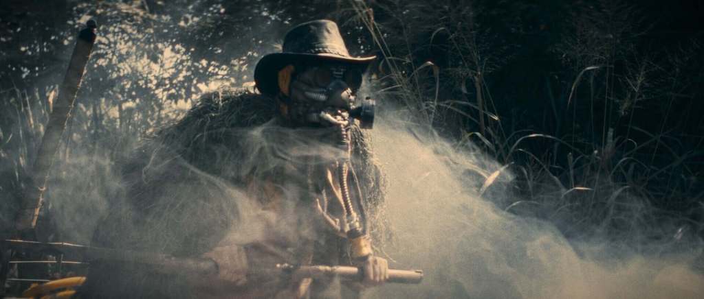 Soldier in foggy jungle with weapon, horror film scene, Warhead film festival.